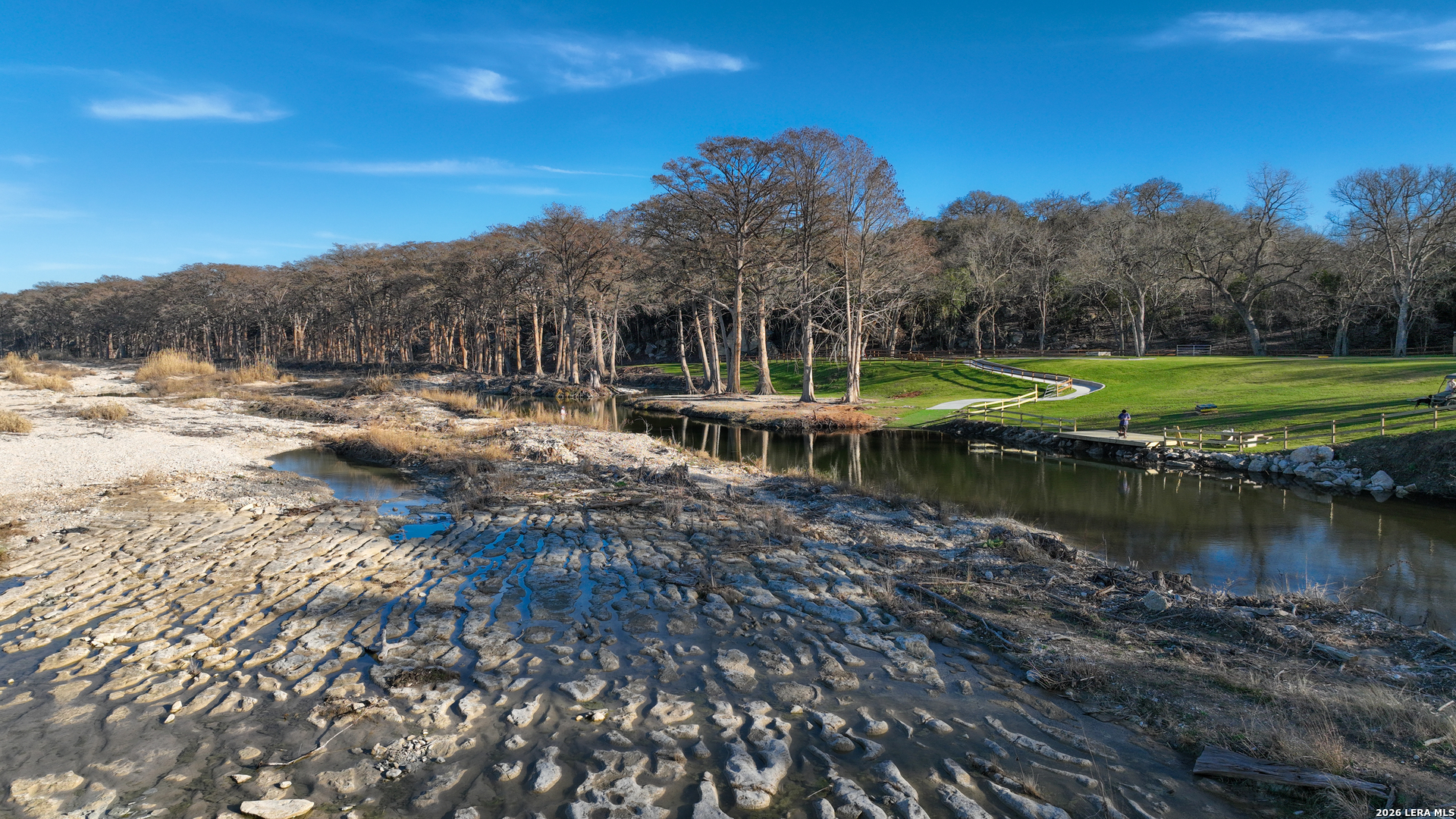 454 Center Point River Road Center Point, TX 78010 - Photo 2 of 18 a view of a lake with houses
