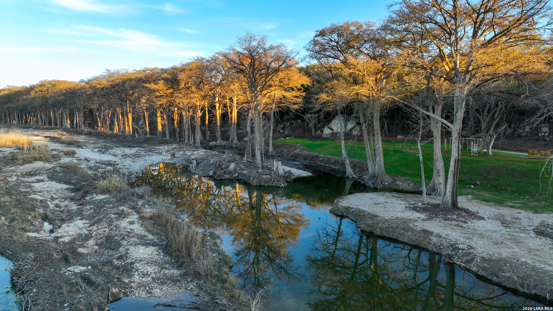 454 Center Point River Road Center Point, TX 78010 - Photo 9 of 18 a view of a backyard with plants and palm tree