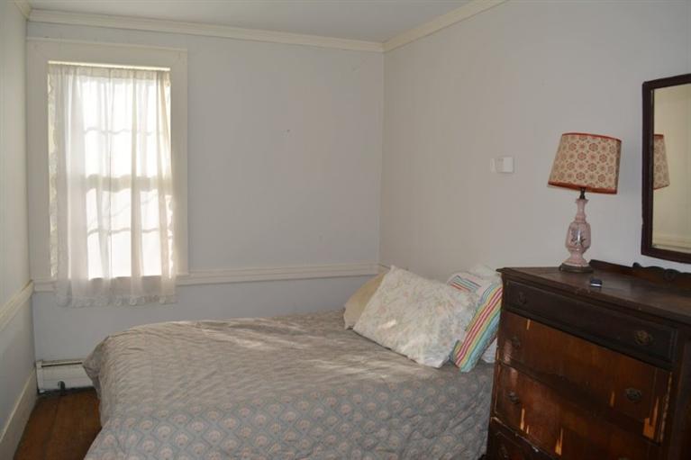 5 Atwood Road Truro, MA 02666 - Photo 13 of 24 a bedroom with a bed and a window
