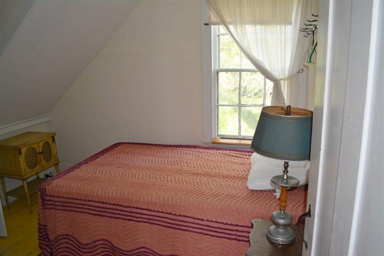 5 Atwood Road Truro, MA 02666 - Photo 16 of 24 a bedroom with a bed and a window