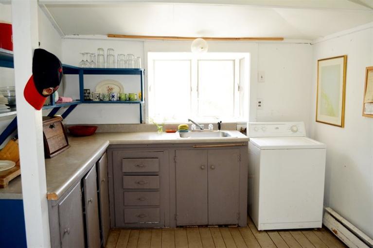 5 Atwood Road Truro, MA 02666 - Photo 9 of 24 a utility room with a sink washer and dryer