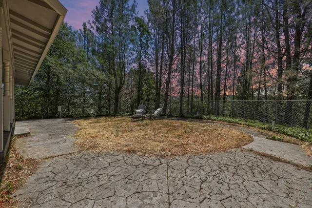 a dining room with furniture and a window