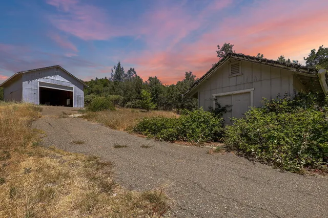 a kitchen with stainless steel appliances granite countertop a refrigerator and stove