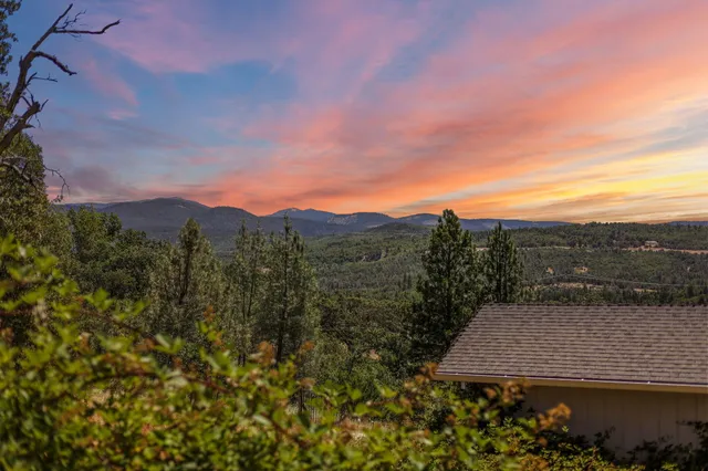 a view of room with window and wooden floor