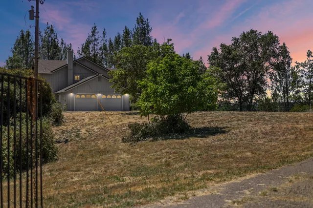 a bedroom with a bed and a mirror on dresser