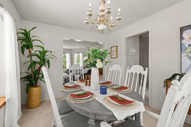 a view of a house with backyard and porch