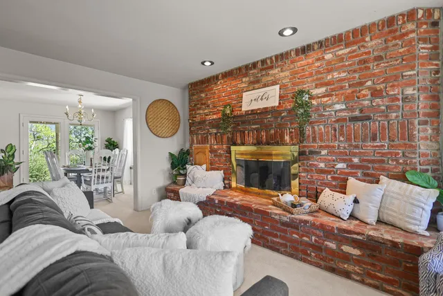 a bathroom with a tub a sink and a large mirror