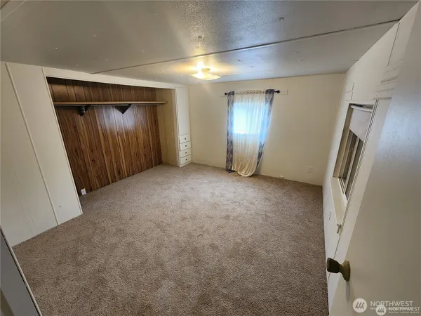 a spacious bathroom with a double vanity sink toilet mirror and bathtub