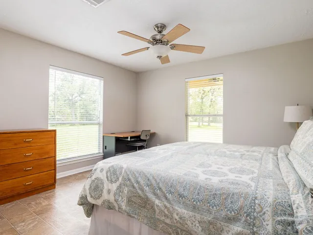 a bedroom with a bed and window