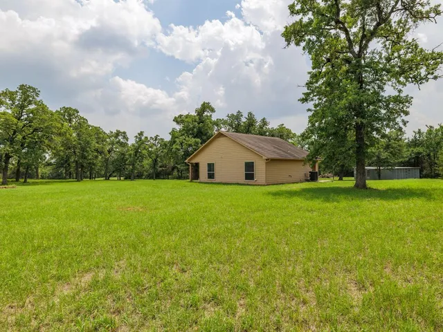 a house view with garden space