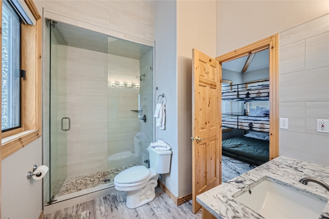 400 Kings Crown Road, Unit 400 Breckenridge, CO 80424 - Photo 11 of 40 a bathroom with a sink toilet and shower