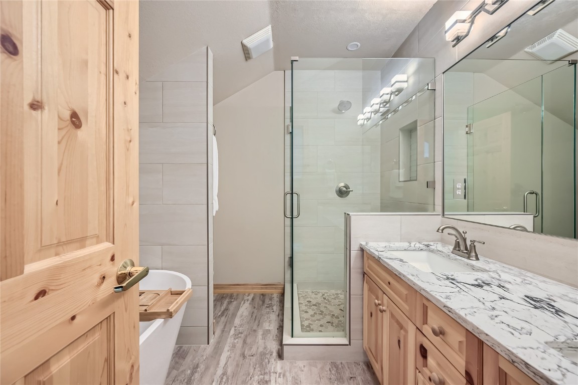 400 Kings Crown Road, Unit 400 Breckenridge, CO 80424 - Photo 15 of 40 a bathroom with a double vanity sink mirror and shower