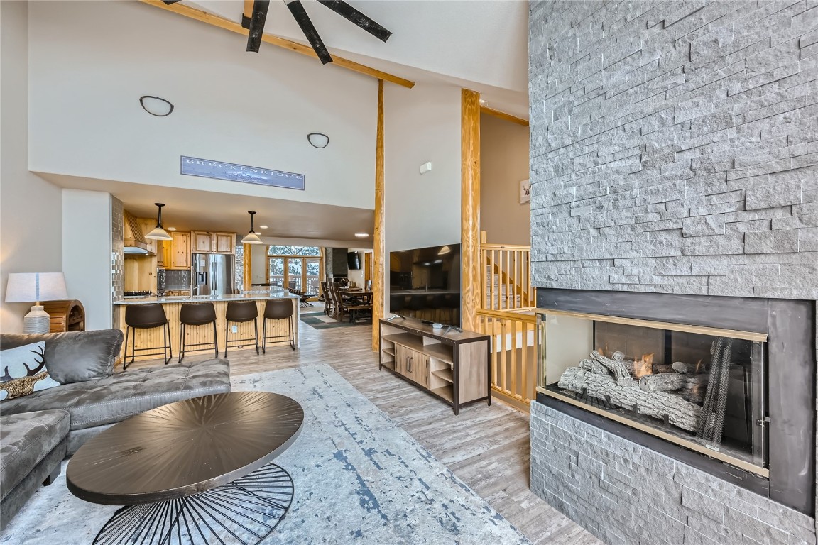 400 Kings Crown Road, Unit 400 Breckenridge, CO 80424 - Photo 2 of 40 a living room with furniture and a fireplace