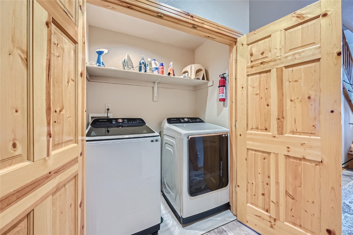 400 Kings Crown Road, Unit 400 Breckenridge, CO 80424 - Photo 23 of 40 a utility room with dryer and washer
