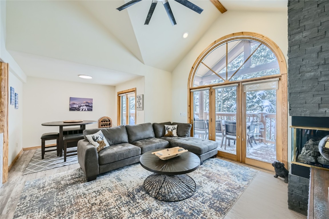 400 Kings Crown Road, Unit 400 Breckenridge, CO 80424 - Photo 7 of 40 a living room with furniture a rug and a floor to ceiling window