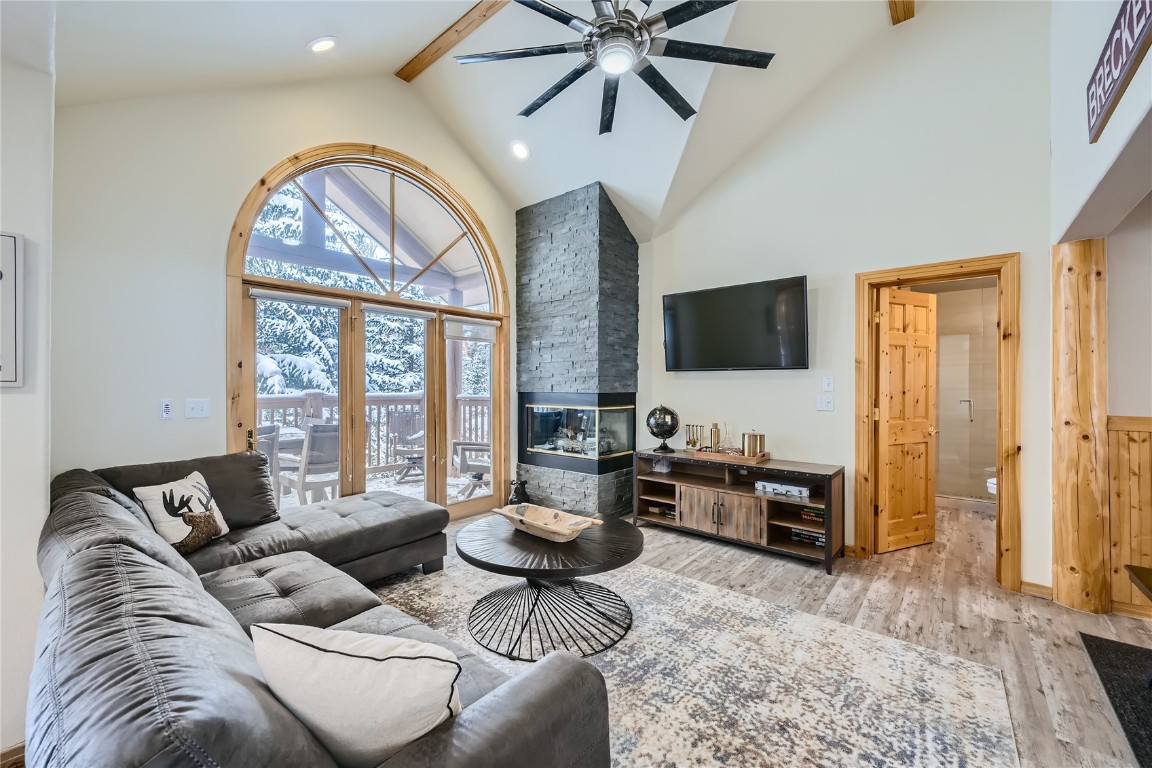 400 Kings Crown Road, Unit 400 Breckenridge, CO 80424 - Photo 8 of 40 a living room with furniture and a flat screen tv