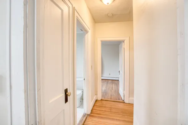 a view of a bathroom from the hallway