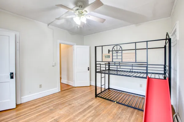 wooden floor with a window in a room