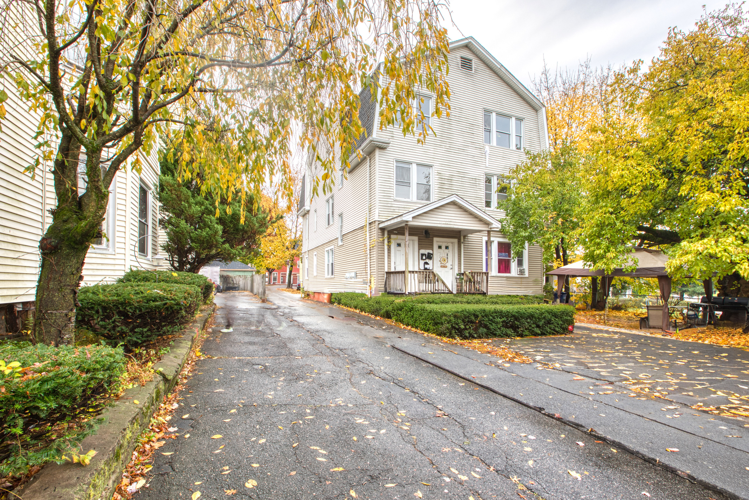 429 New Britain Avenue Hartford, CT 06106 - Photo 2 of 20 a view of a white house with a large tree and plants
