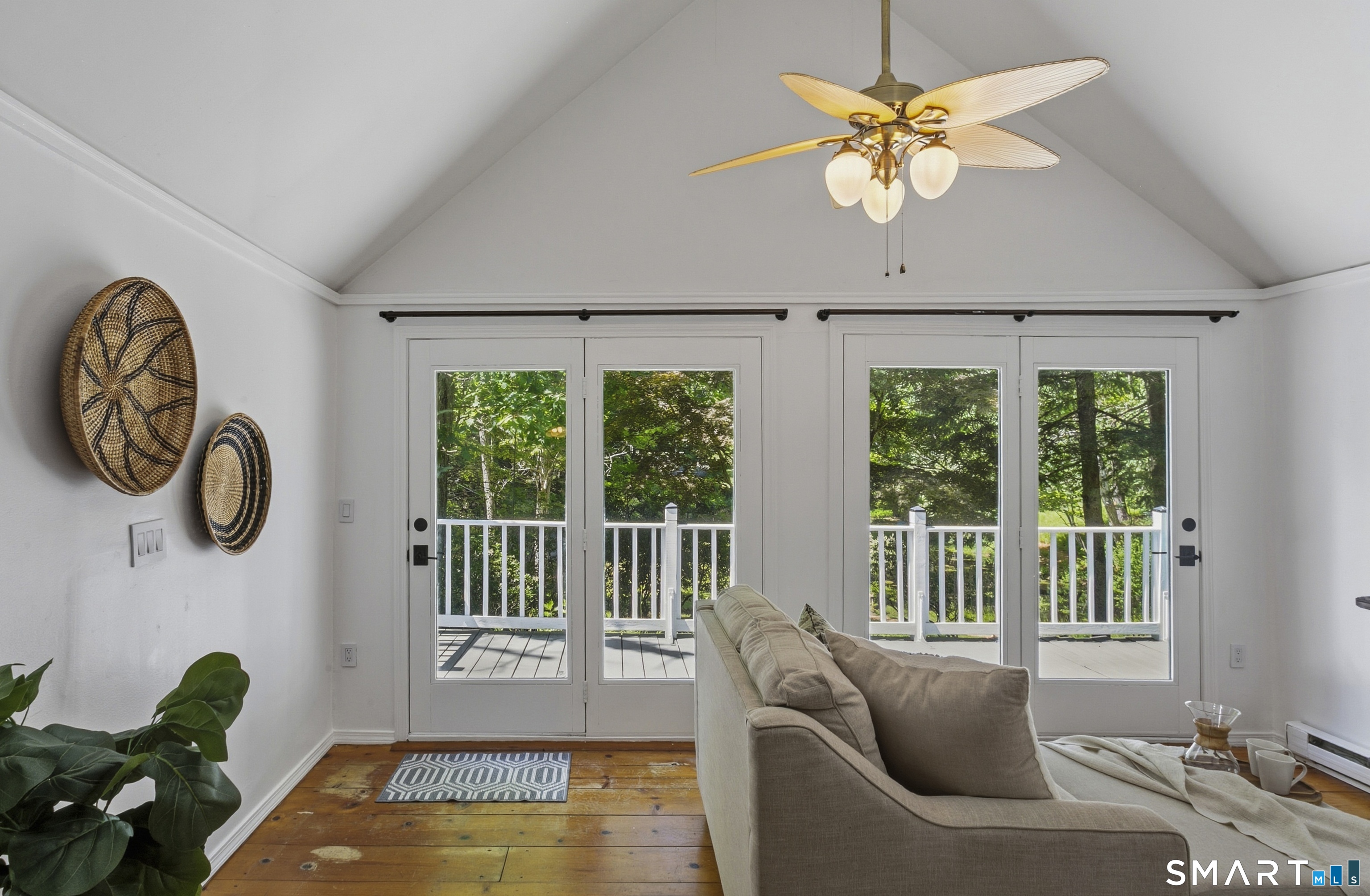 188 Bacon Road Roxbury, CT 06783 - Photo 10 of 33 a view of a dining room with furniture a chandelier and a large window
