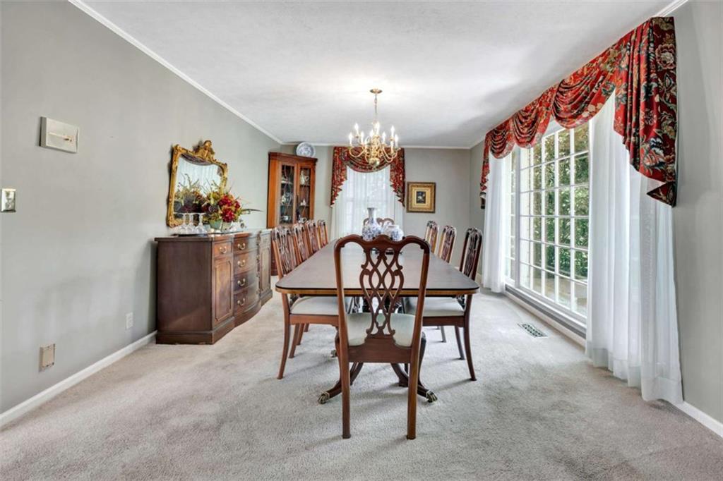 103 Gabriel Way Social Circle, GA 30025 - Photo 15 of 70 a dining room with furniture and window