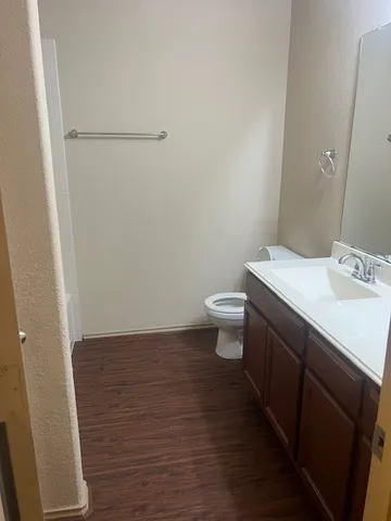a bathroom with a sink toilet and vanity