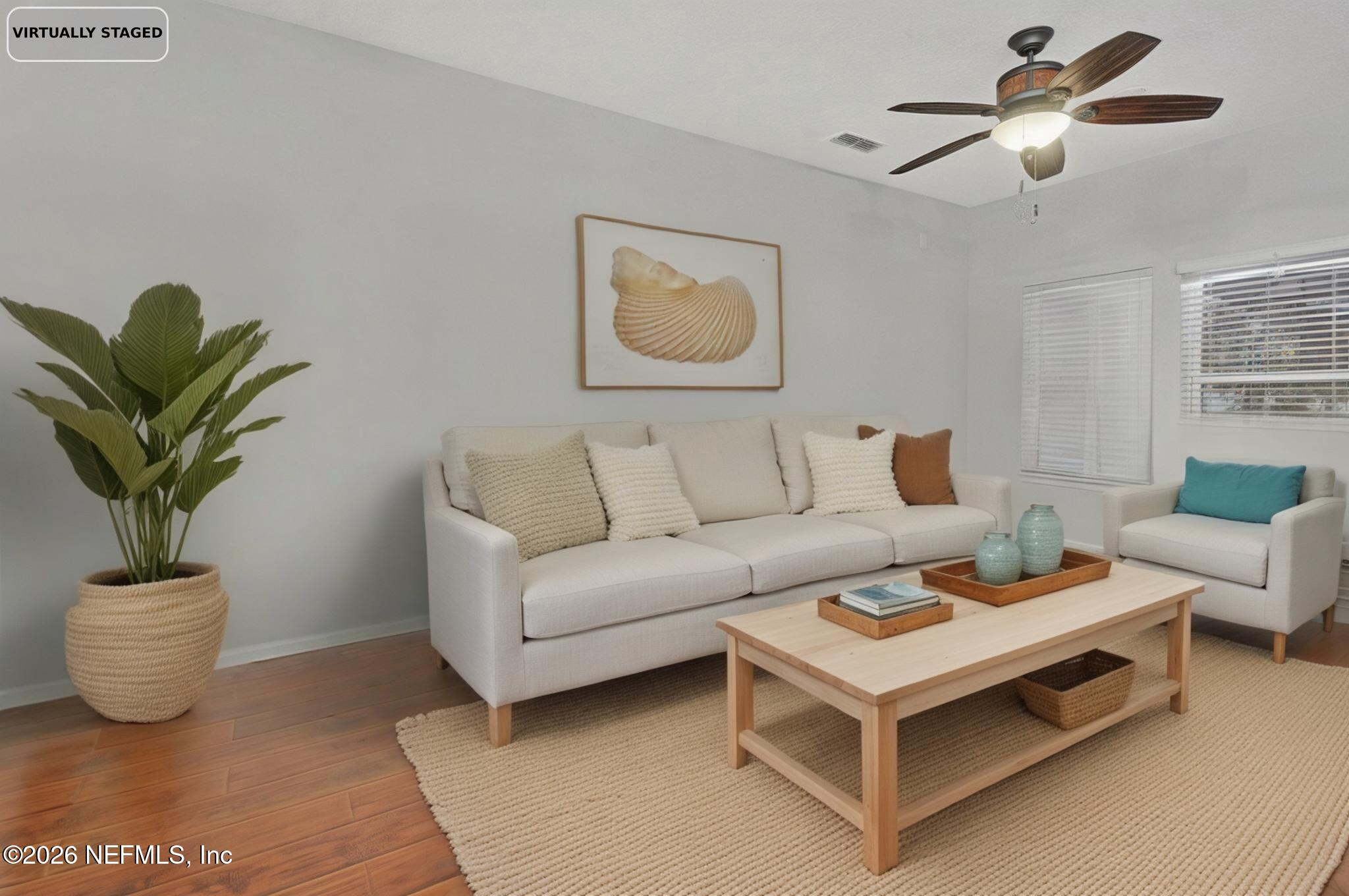 1537 Landau Road Jacksonville, FL 32225 - Photo 3 of 12 a living room with furniture and a potted plant
