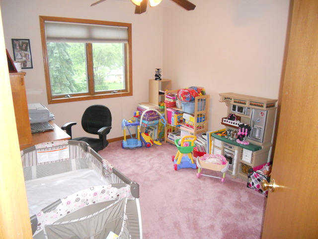 97 Monee Road Park Forest, IL 60466 - Photo 17 of 25 a children room with toys and a window