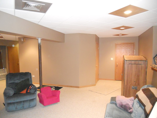 97 Monee Road Park Forest, IL 60466 - Photo 22 of 25 a bedroom with a bed and a couch