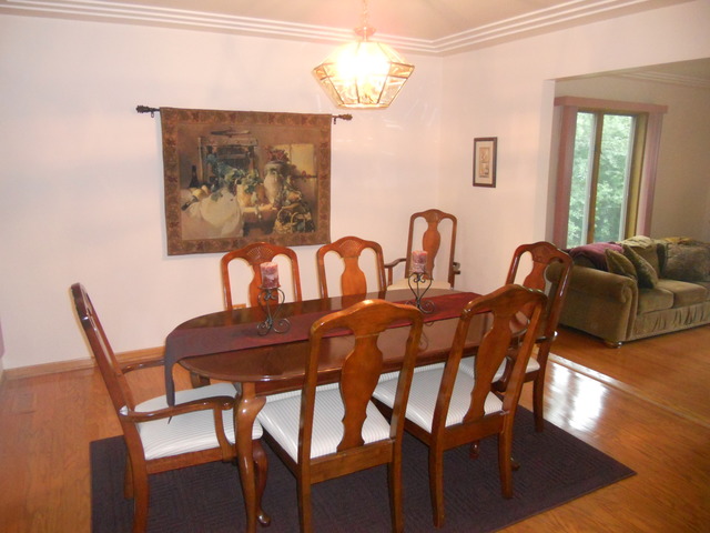 97 Monee Road Park Forest, IL 60466 - Photo 4 of 25 a view of a dining room with furniture and wooden floor