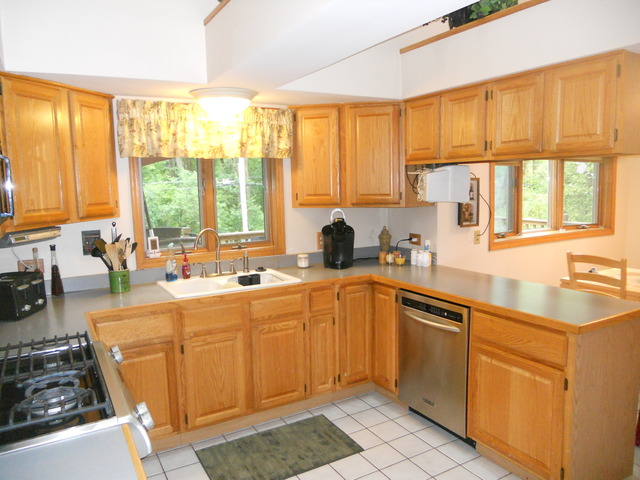 97 Monee Road Park Forest, IL 60466 - Photo 8 of 25 a kitchen with a sink stove top oven and cabinets