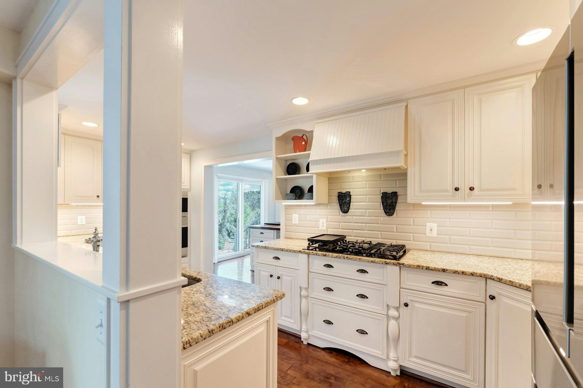 16555 Old Waterford Road Paeonian Springs, VA 20129 - Photo 18 of 92 a kitchen with granite countertop a sink and a stove top oven