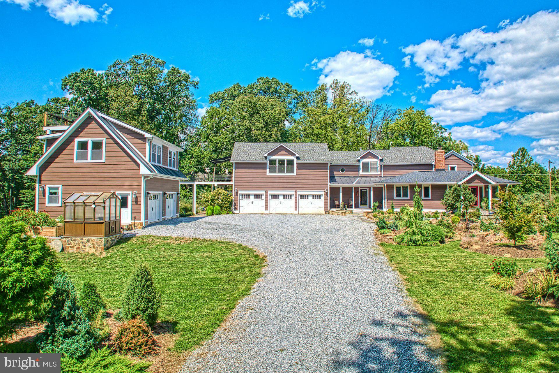 16555 Old Waterford Road Paeonian Springs, VA 20129 - Photo 2 of 92 a front view of a house with a garden