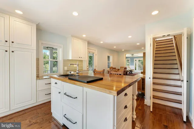 a bathroom with a sink a mirror and a shower