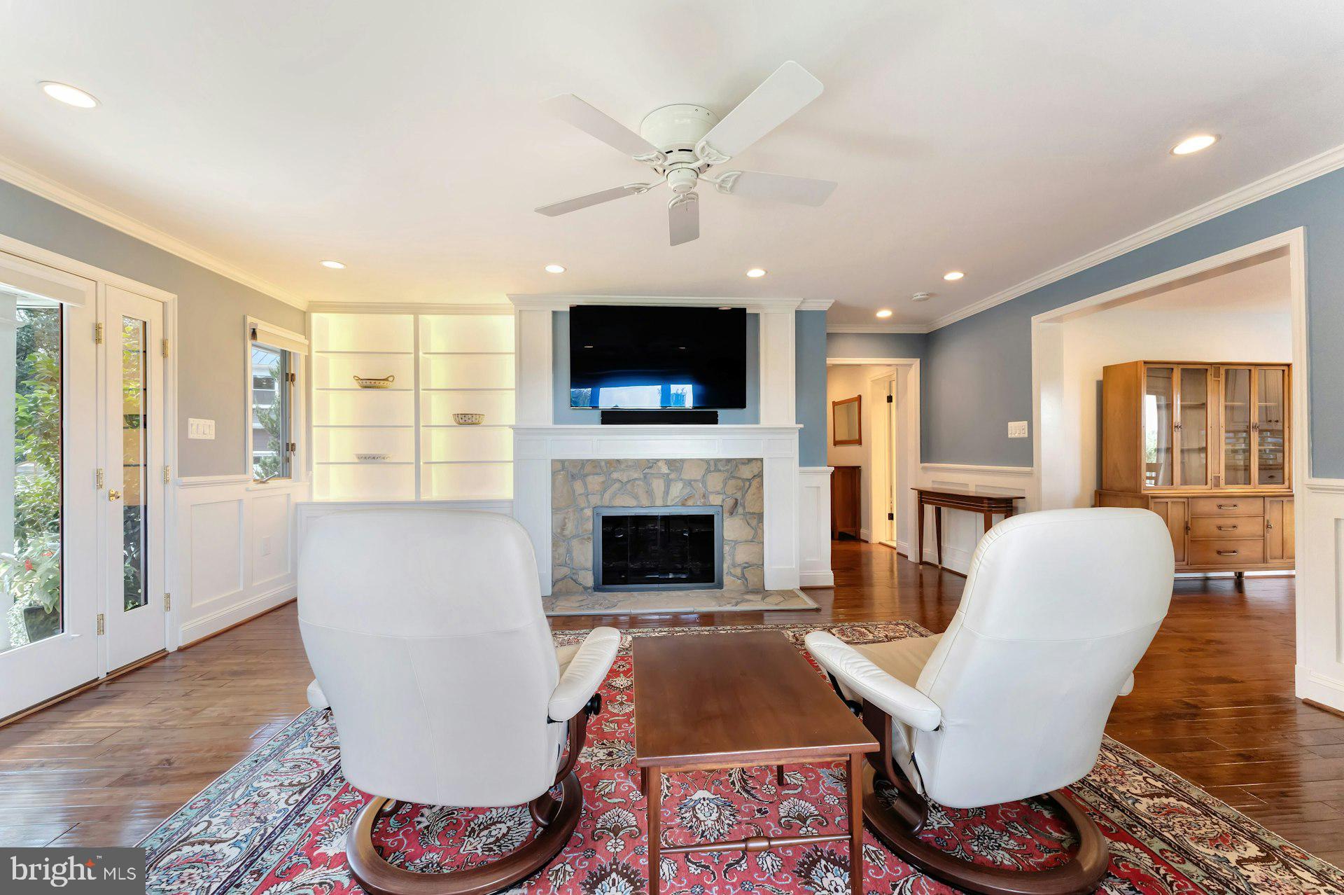 16555 Old Waterford Road Paeonian Springs, VA 20129 - Photo 29 of 92 a living room with furniture a flat screen tv and a fireplace