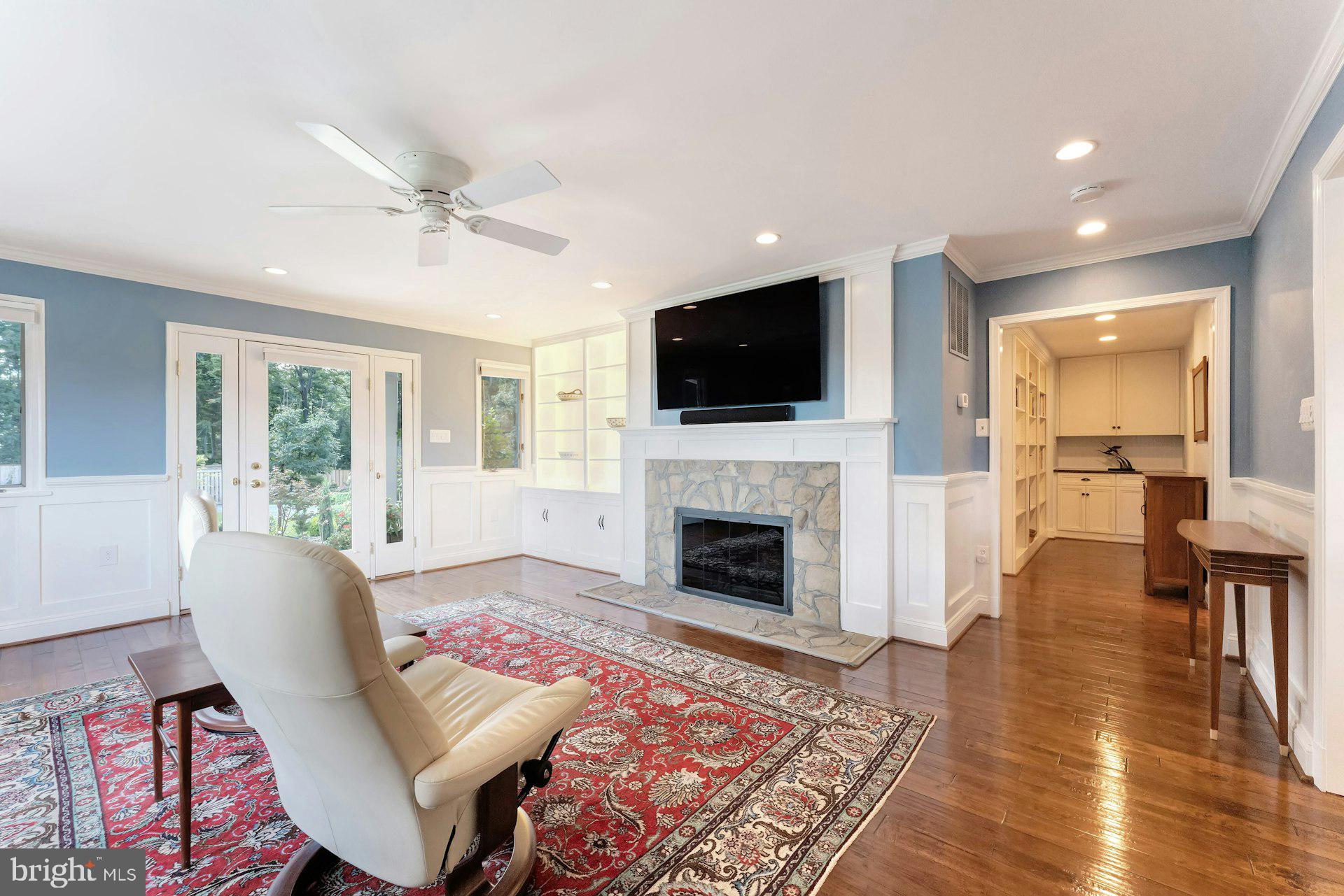 16555 Old Waterford Road Paeonian Springs, VA 20129 - Photo 31 of 92 a living room with furniture a flat screen tv and a fireplace