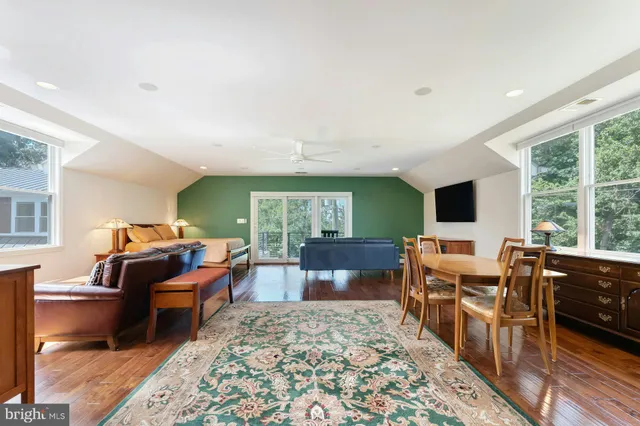 a view of balcony with deck and outdoor seating