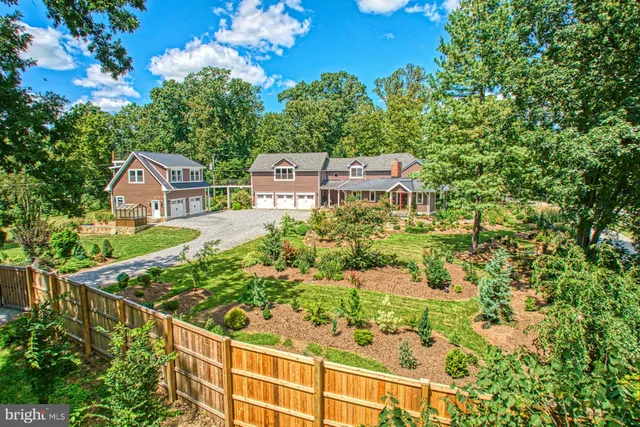 a view of a porch with furniture and wooden floor