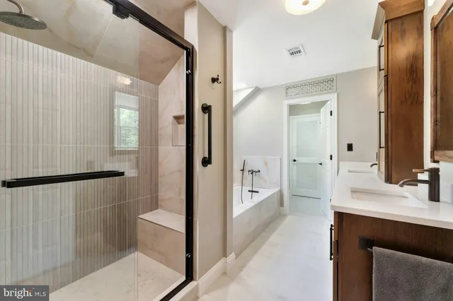 a view of a work space with wooden floor and a window
