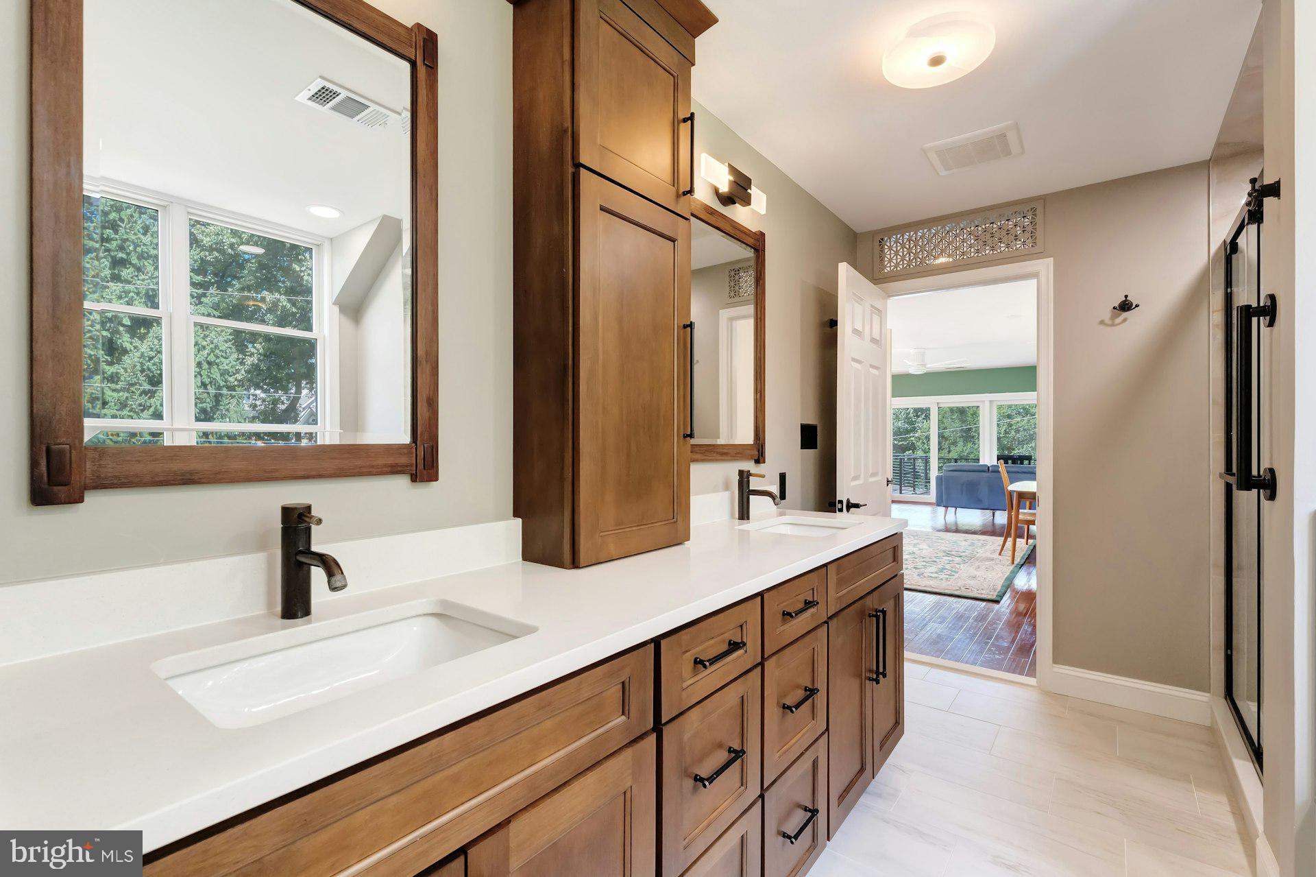 16555 Old Waterford Road Paeonian Springs, VA 20129 - Photo 45 of 92 a bathroom with a sink double vanity and a mirror