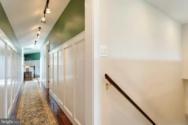 an aerial view of a house with a yard and trees