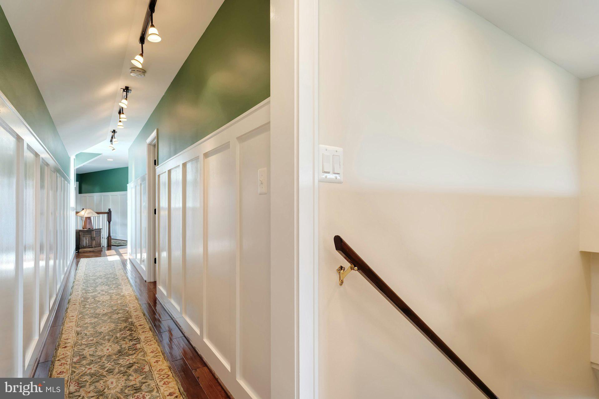 16555 Old Waterford Road Paeonian Springs, VA 20129 - Photo 50 of 92 a view of a hallway with wooden floor and staircase