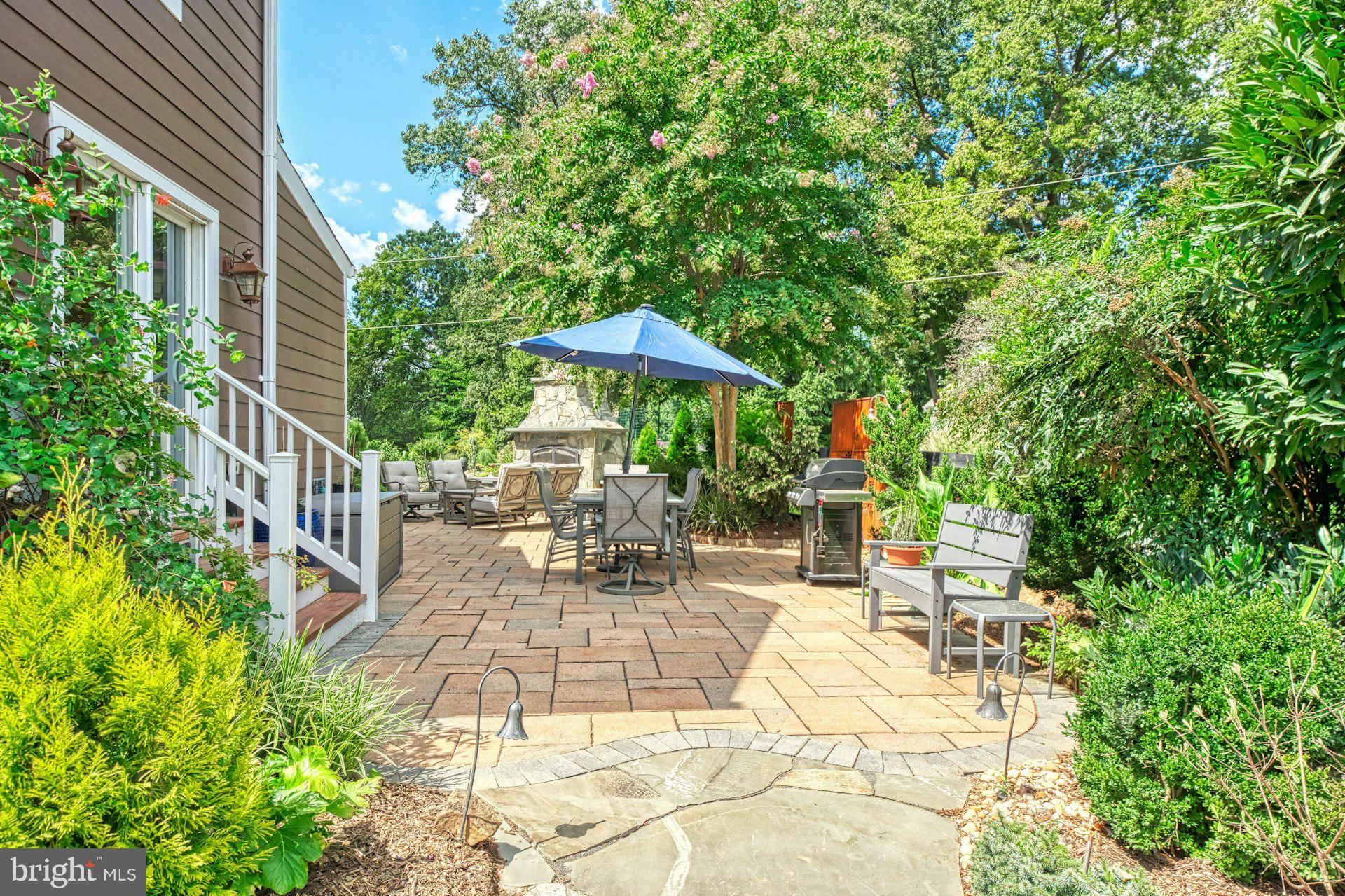 16555 Old Waterford Road Paeonian Springs, VA 20129 - Photo 57 of 92 a view of a patio with table and chairs potted plants and large tree