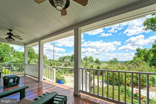 a view of entryway with stairs and wooden floor