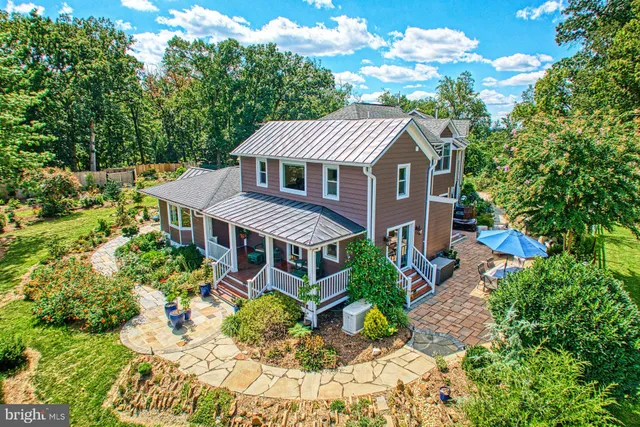 a living room with furniture a rug and a table