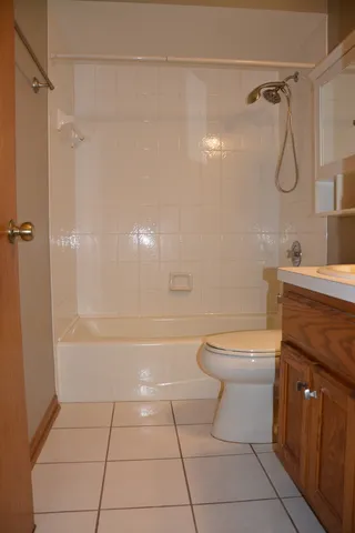 a view of an empty room with a fireplace