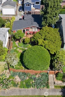 a view of a backyard with sitting area