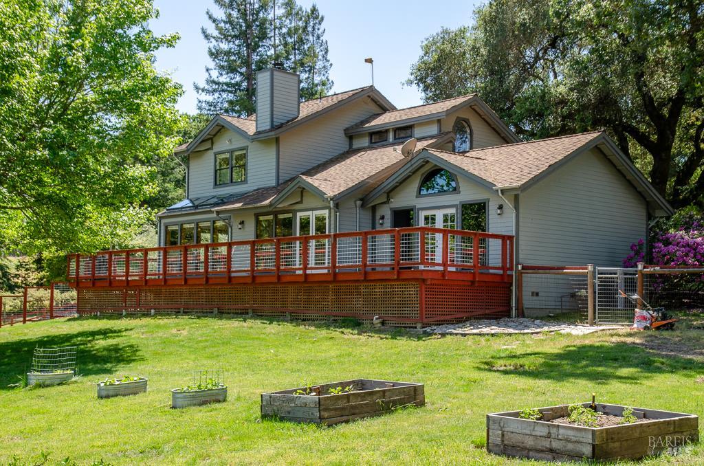 a front view of a house with a yard table and chairs