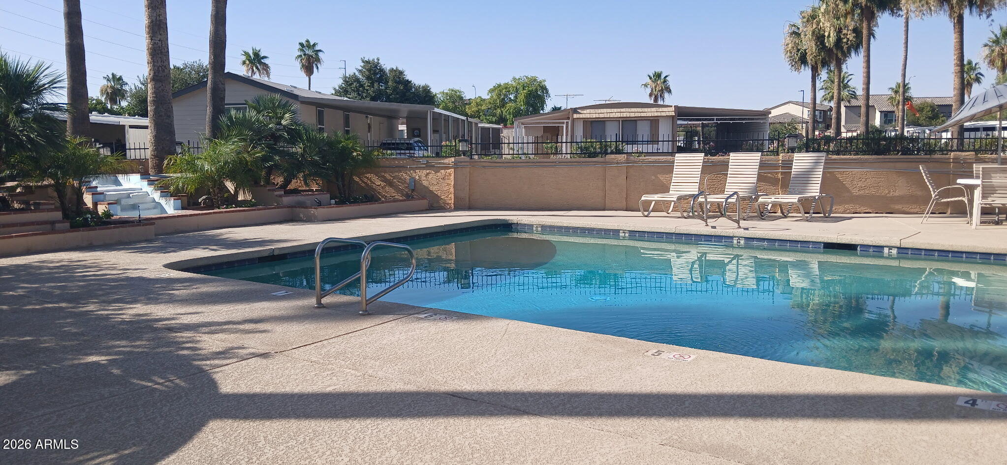200 East Knox Road, Unit 91 Chandler, AZ 85225 - Photo 36 of 37 a front view of a house with swimming pool