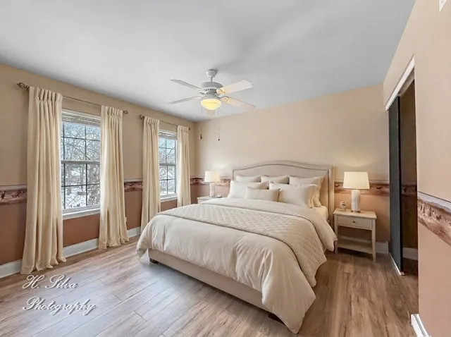 a bedroom with a bed furniture and a window